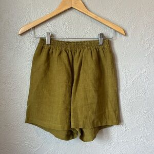 Olive linen shorts by local slow fashion brand Mack Made, size small.